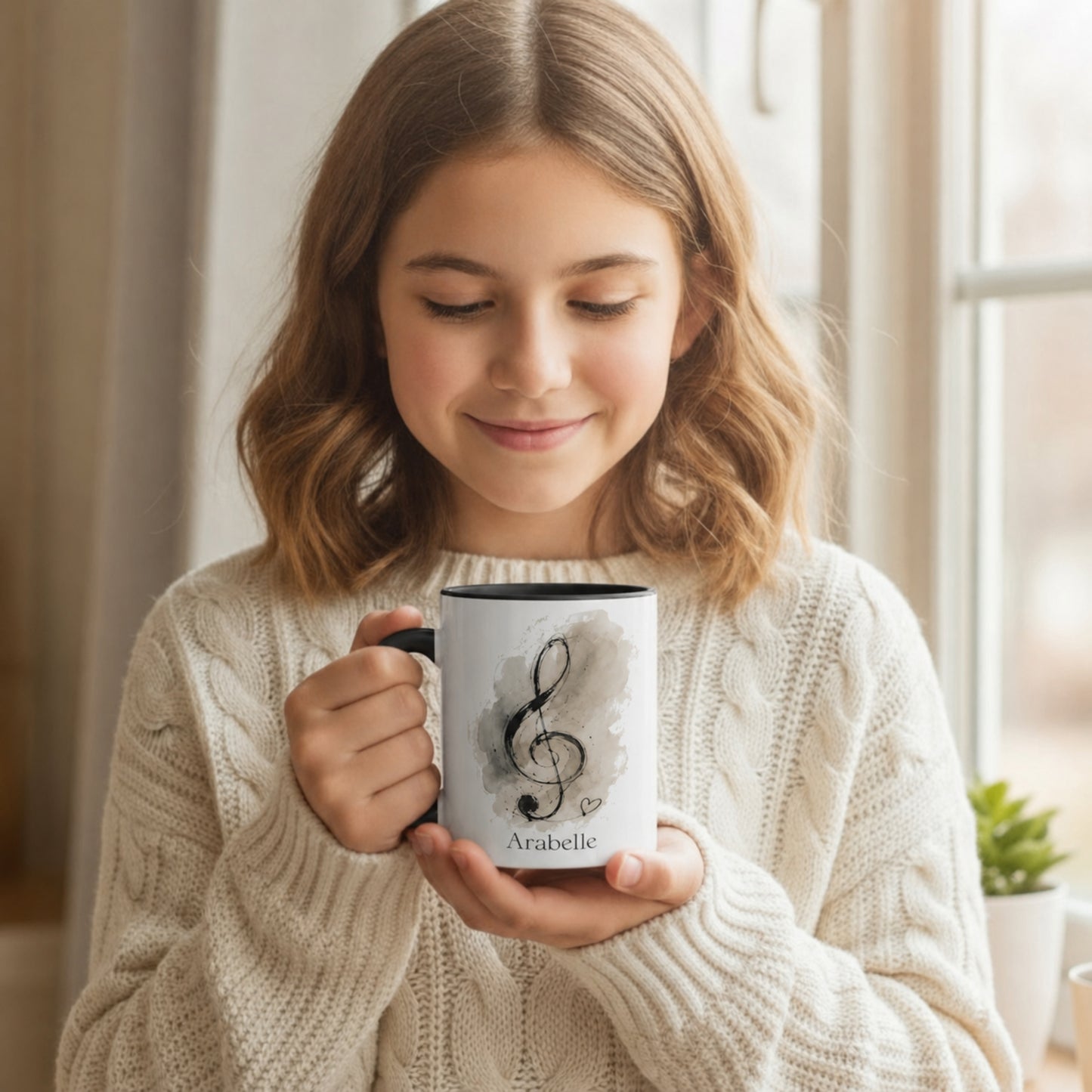 Young music student holding the Treble Dreams Arabelle personalised music mug while enjoying a warm drink.