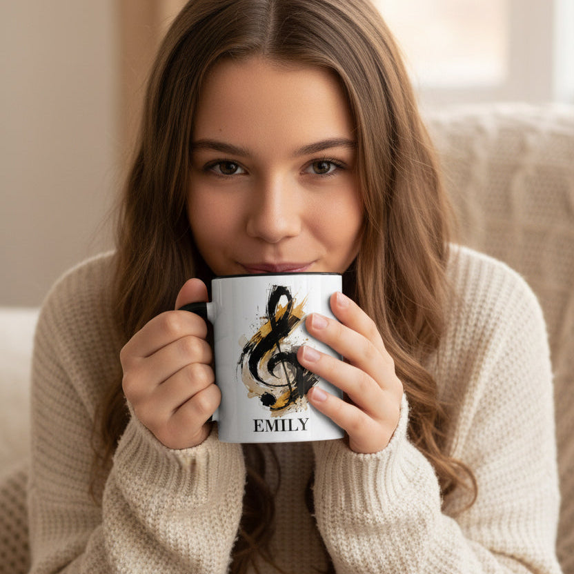 Young girl holding the personalised Signature Style piano mug with black handle featuring a painterly treble clef and custom name