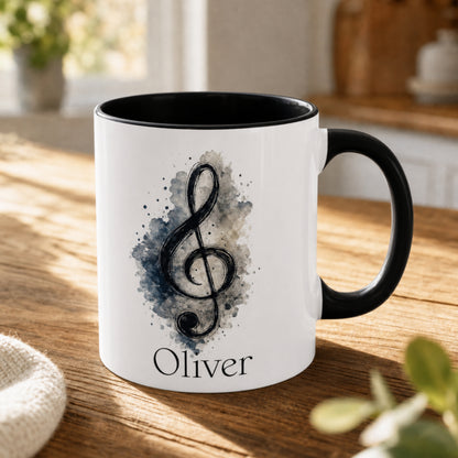 Personalised Treble Adventures piano mug with black handle featuring a blue-grey painterly treble clef and custom name