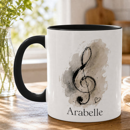 Close-up of the Treble Dreams personalised piano mug featuring expressive treble clef artwork with a custom student name.
