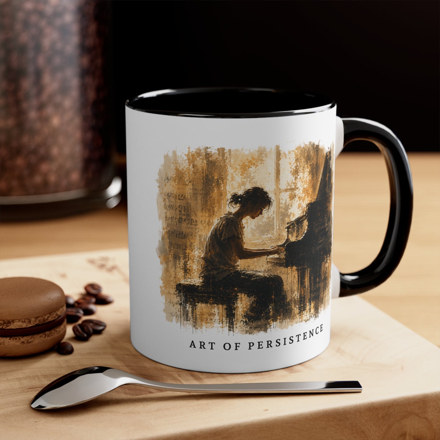 Art of Becoming piano mug displayed on a wooden table beside coffee beans and a spoon.