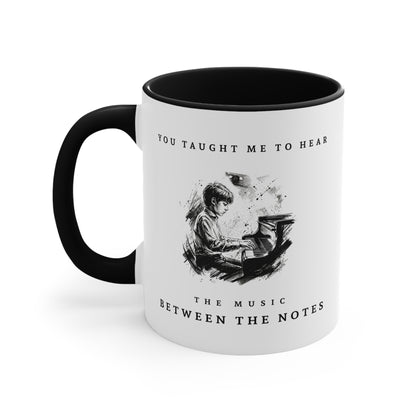 Left view of The Music Between the Notes II piano mug featuring monochrome artwork of a young pianist and inspirational typography.