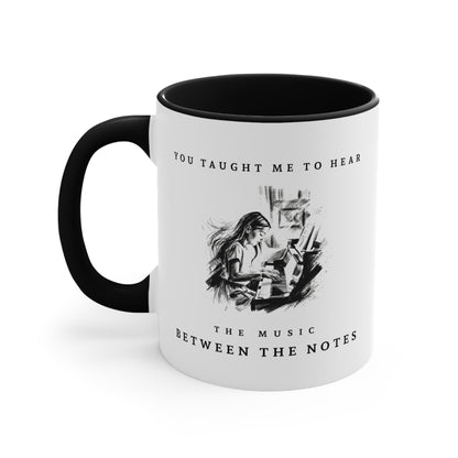 Left view of The Music Between the Notes I piano mug featuring monochrome artwork and inspirational typography.
