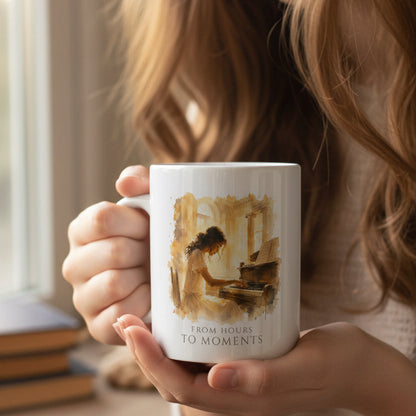 From Hours to Moments piano mug held in a warm, relaxed home setting.