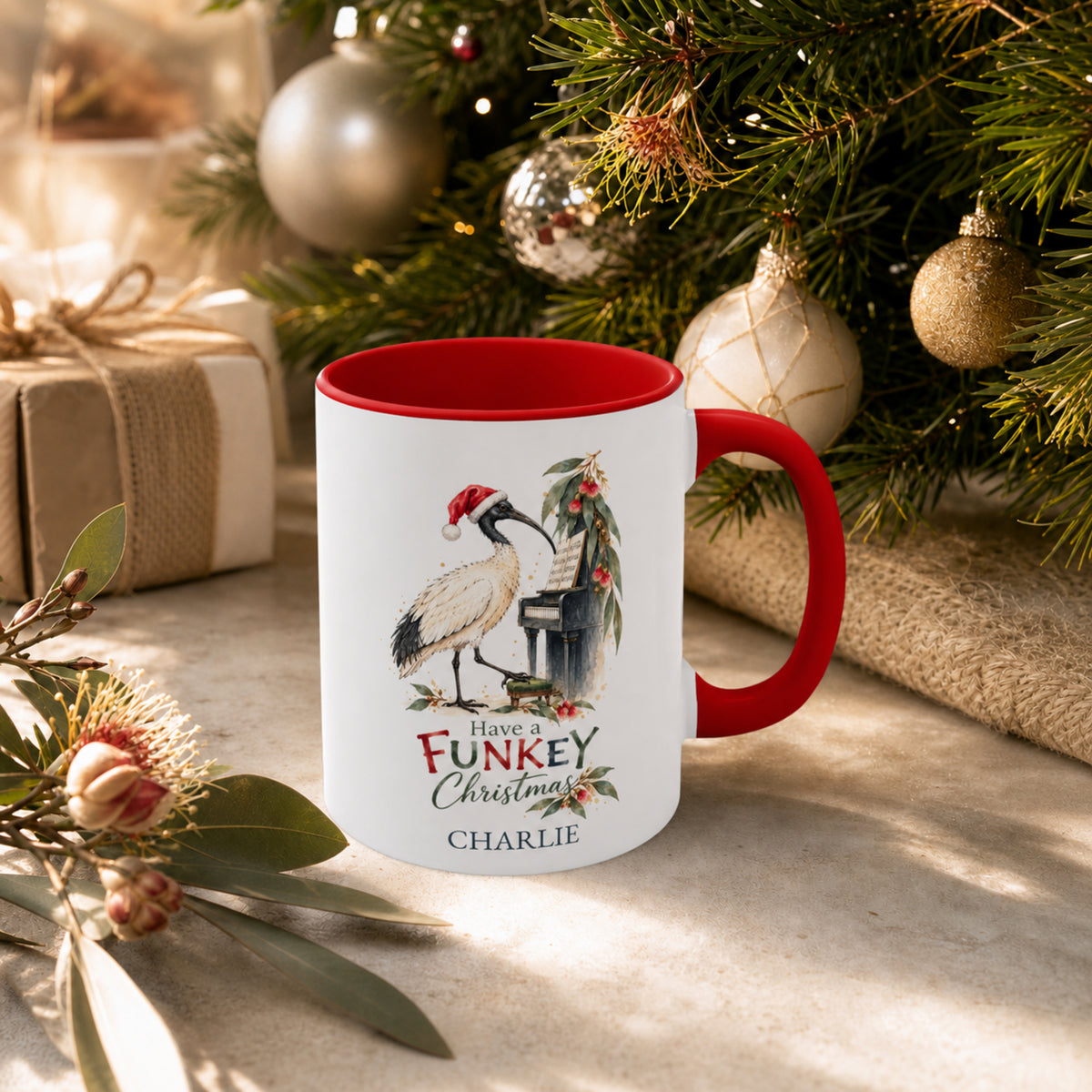 Personalised ibis piano Christmas mug displayed beside an Australian Christmas tree
