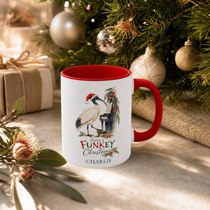 Personalised ibis piano Christmas mug displayed beside an Australian Christmas tree