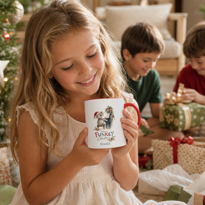 Young pianist holding a personalised koala piano Christmas mug with red handle