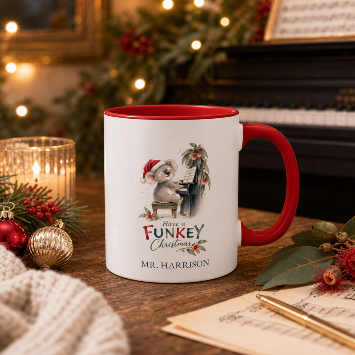 Personalised koala piano teacher Christmas mug displayed beside a piano and Christmas decorations