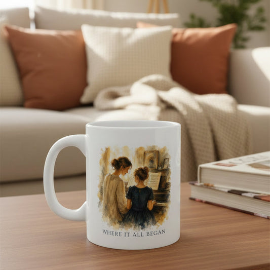 White piano teacher appreciation mug featuring the Where It All Began artwork on a coffee table in a warm living room.